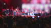 Blurred slow motion of a music concert fans enjoying themselves